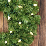 70 C6 Warm White LED Christmas Lights, 4" Spacing, Green Wire